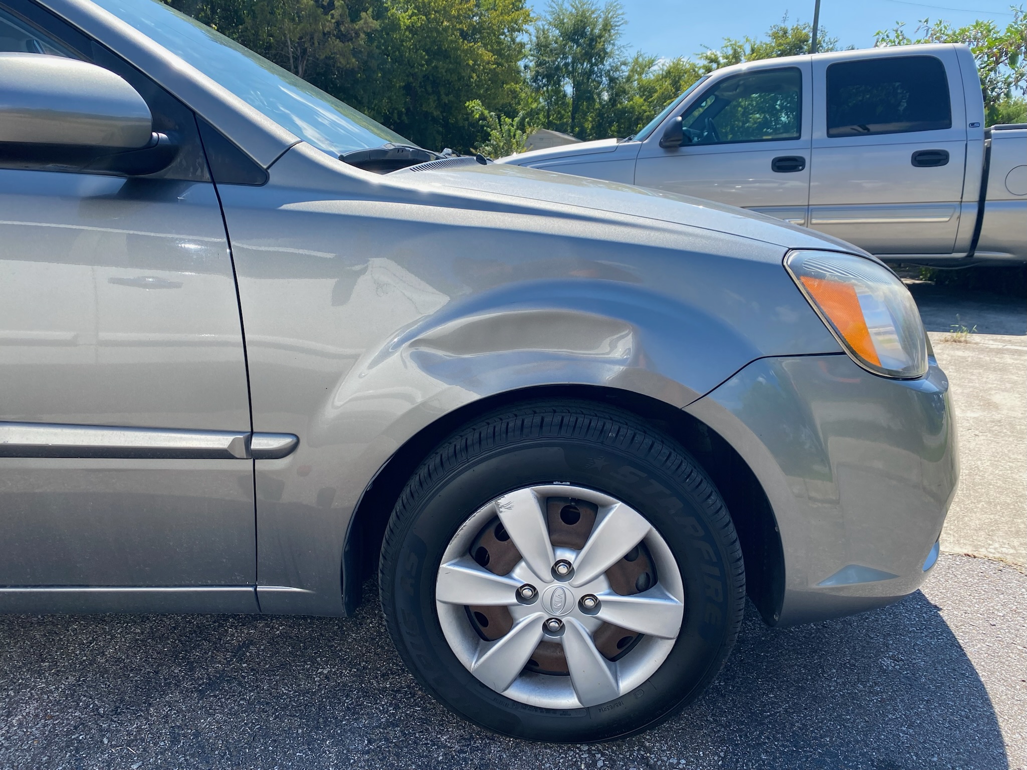 Vehicle dent before paintless dent repair