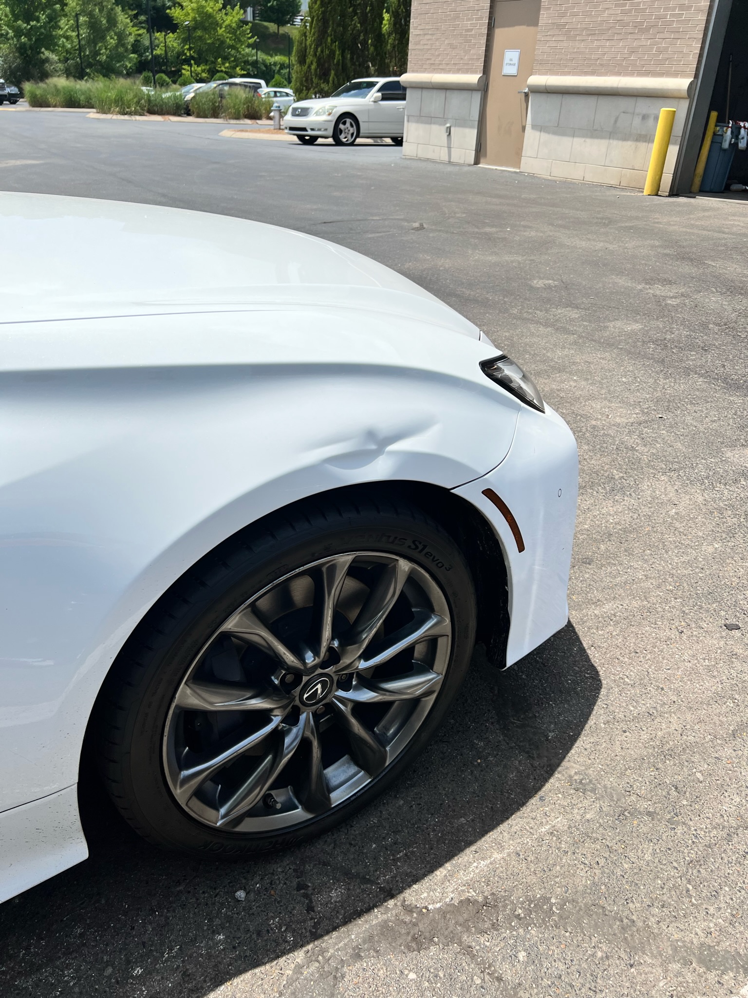 Lexus fender dent before paintless dent repair